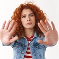 Фото с сайта <a href="https://www.freepik.com/free-photo/no-you-must-stop-seriouslooking-displeased-ginger-girl-25s-curly-hairstyle-extend-palms-forward-frowning-prohibiting-asking-hold-give-restriction-demanding-forbid-bad-treatment-animals_24532379.htm">Image by cookie_studio</a> on Freepik